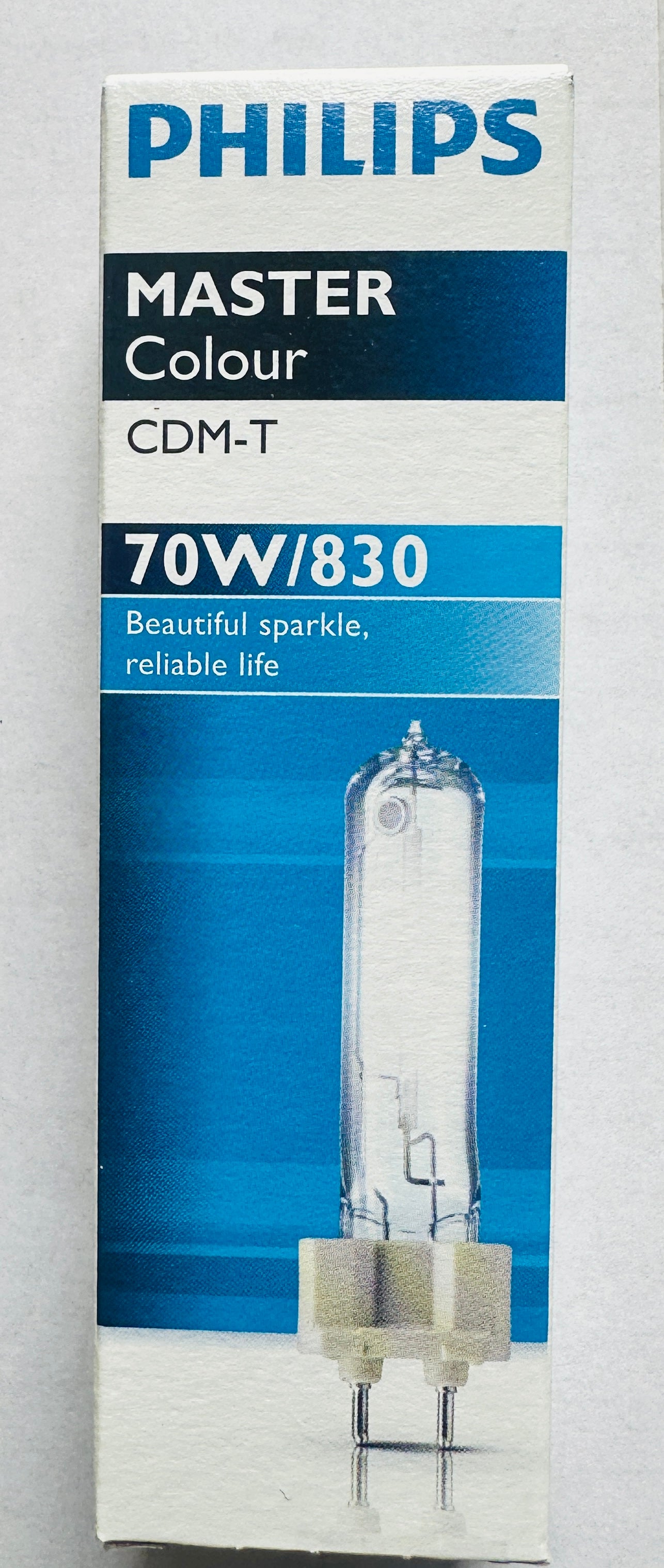 Philips Master Colour CDM-T 70W/830 glass light bulb in its original blue and white retail packaging box.